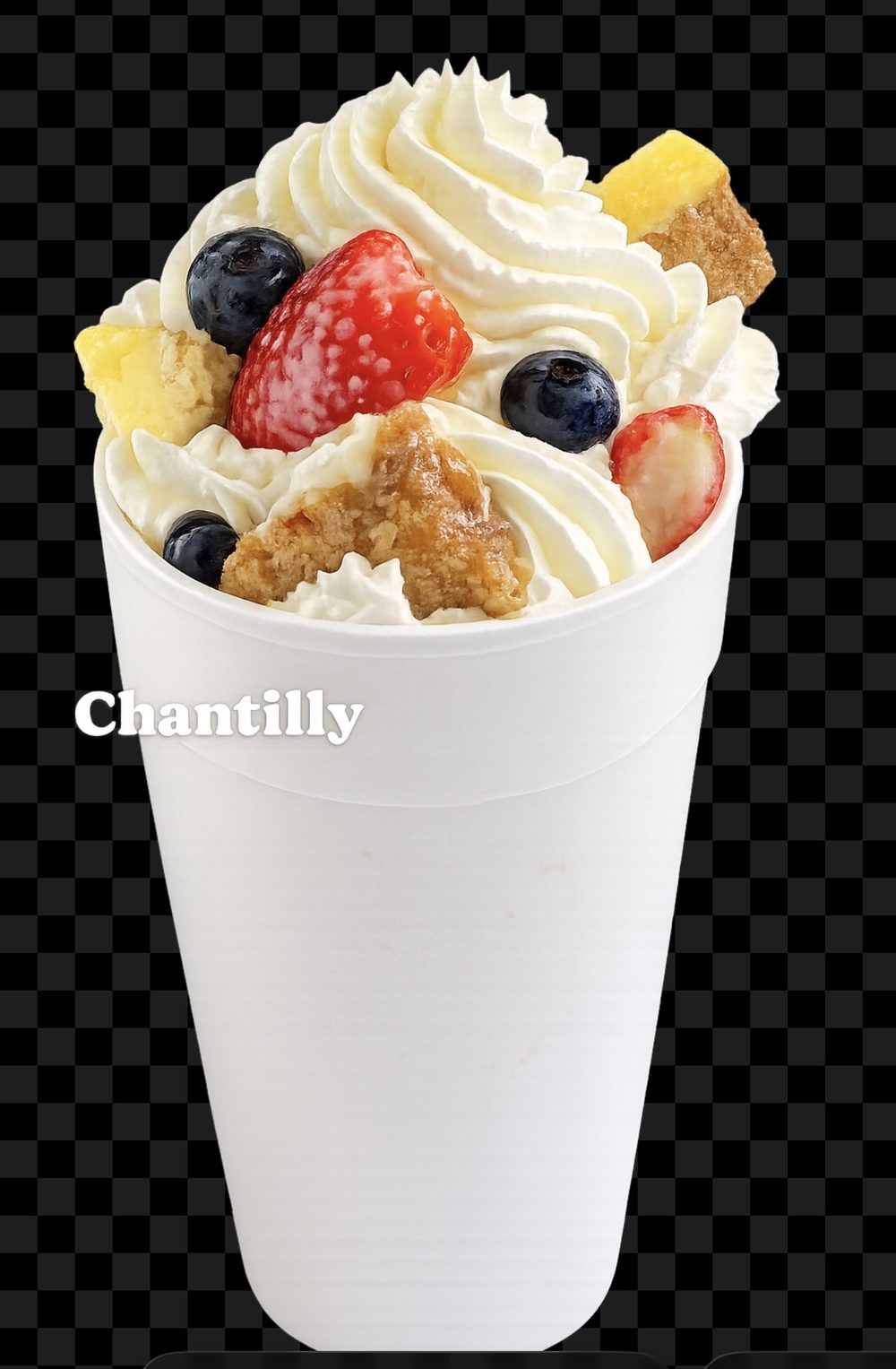 Specialty snowball topped with whipped cream, strawberries, and blueberries