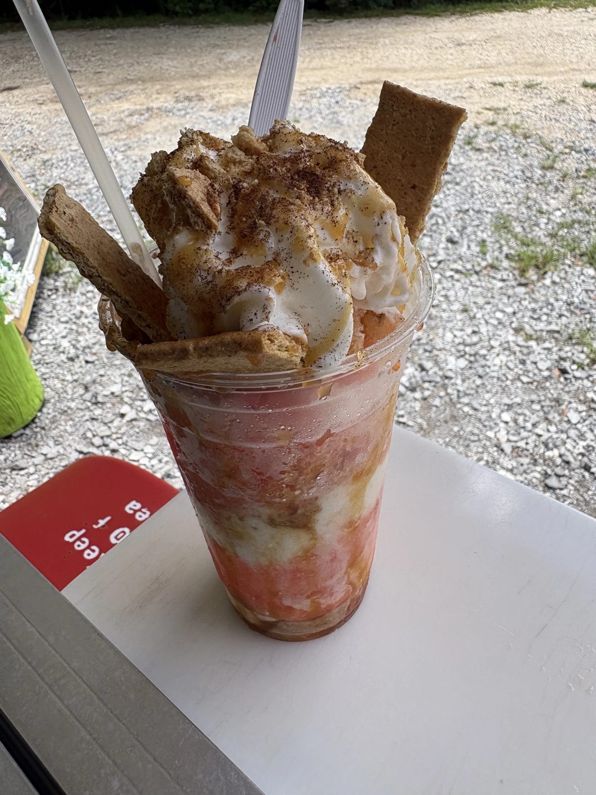 Stuffed specialty snowball with whipped cream and cookie pieces
